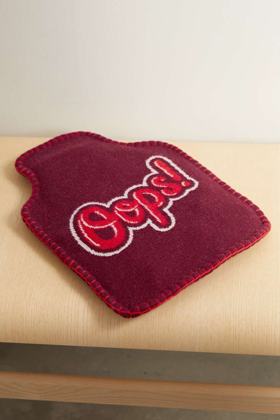 Oops! Intarsia Wool Hot Water Bottle Cover from Anya Hindmarch