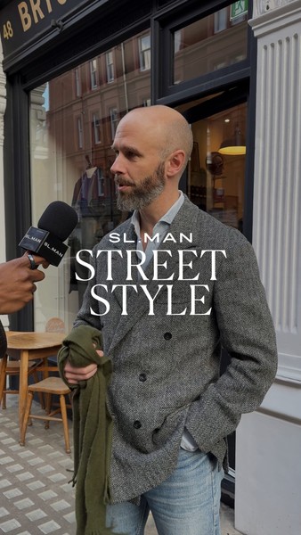 Picture of a stylish man stood outside a shop front